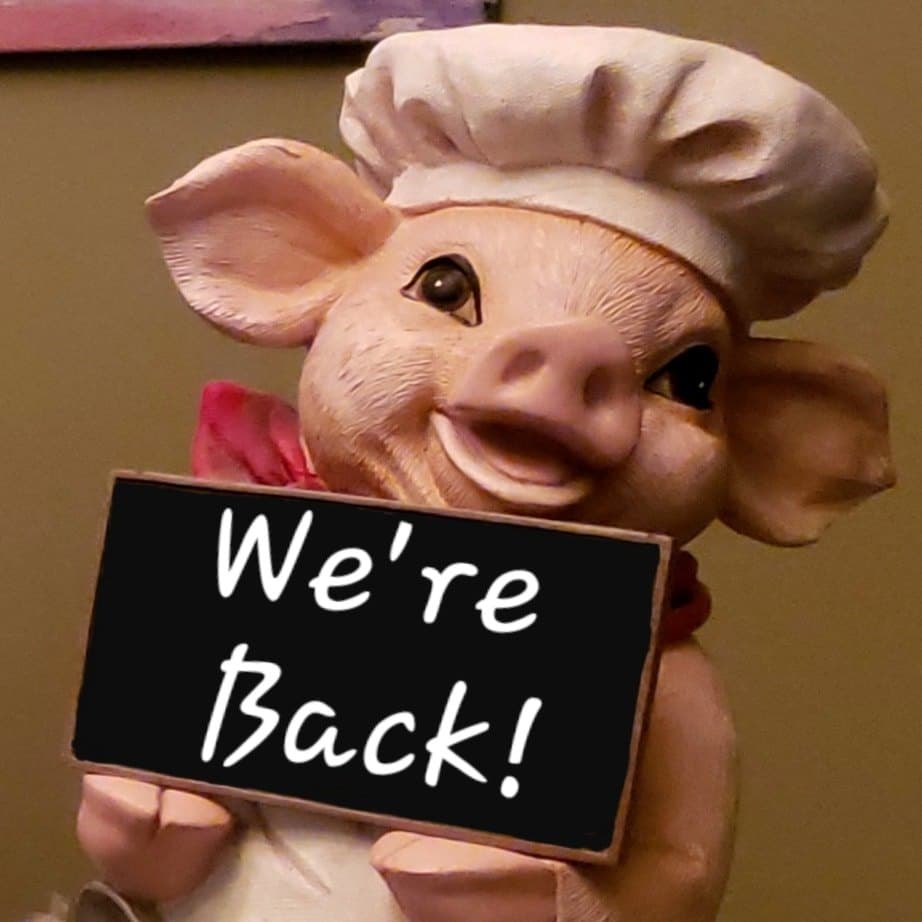Pig holding we're back sign